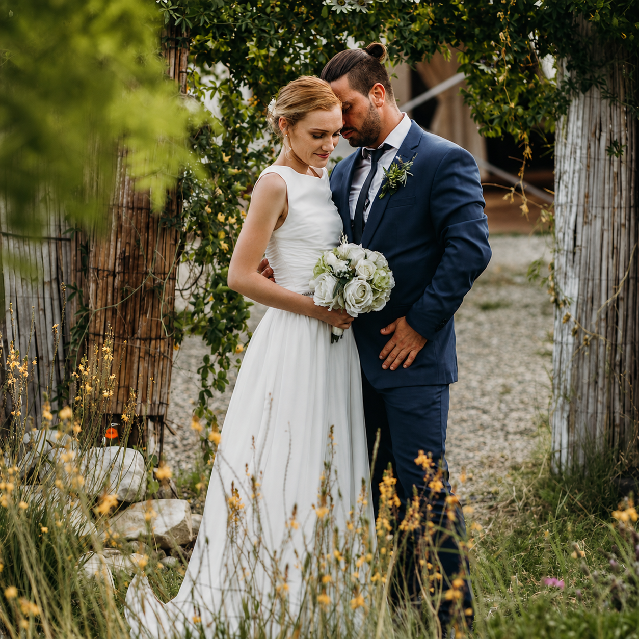Bride and groom together in a Mediterranean garden